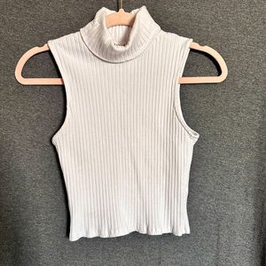 White sleeveless turtleneck crop top